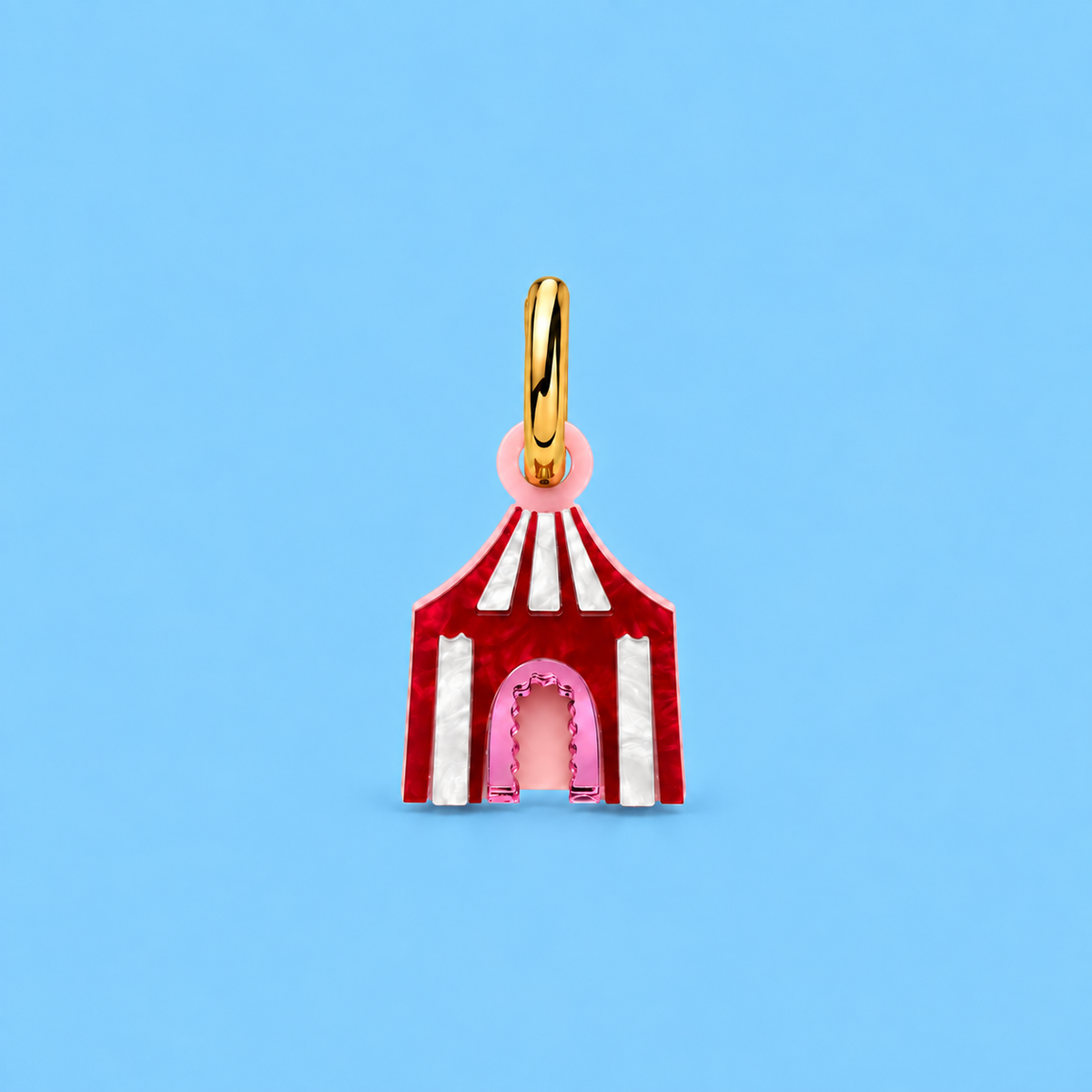 Weezy Pop circus tent charm in red and white stripes, shown on a blue background