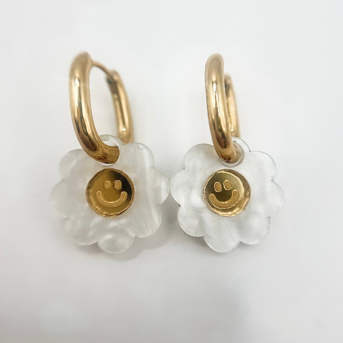 Smiley Flower Huggie Earrings from Weezy Popshop.